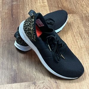 New Balance black cheetah heel sneaker